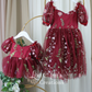 matching sister outfits in burgundy floral