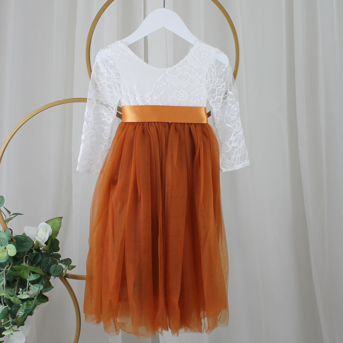 Tulle flower girl dress in burnt orange with white long sleeve lace bodice