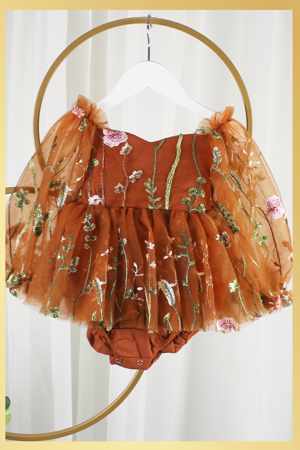 Fall Floral baby girl dress in burnt orange floral embroidery with long tulle sleeves and knee length style and built in bodysuit. 