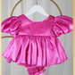 baby girl dress in fuchsia pink. Big puffy sleeves in romper style Organza shiny material. For first birthdays and flower girl dresses for weddings