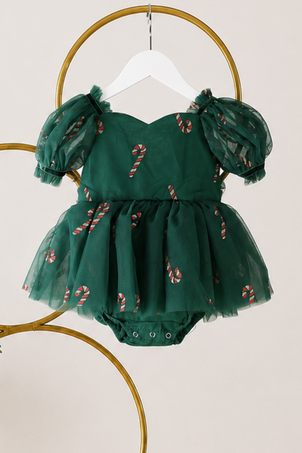 Green Christmas dress girl style with short puff sleeves, sweetheart neckline and red and gold glitter candy cane tulle.