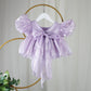 Lavender baby girl dress with puff sleeves and a bow. First birthday dress in Organza 
