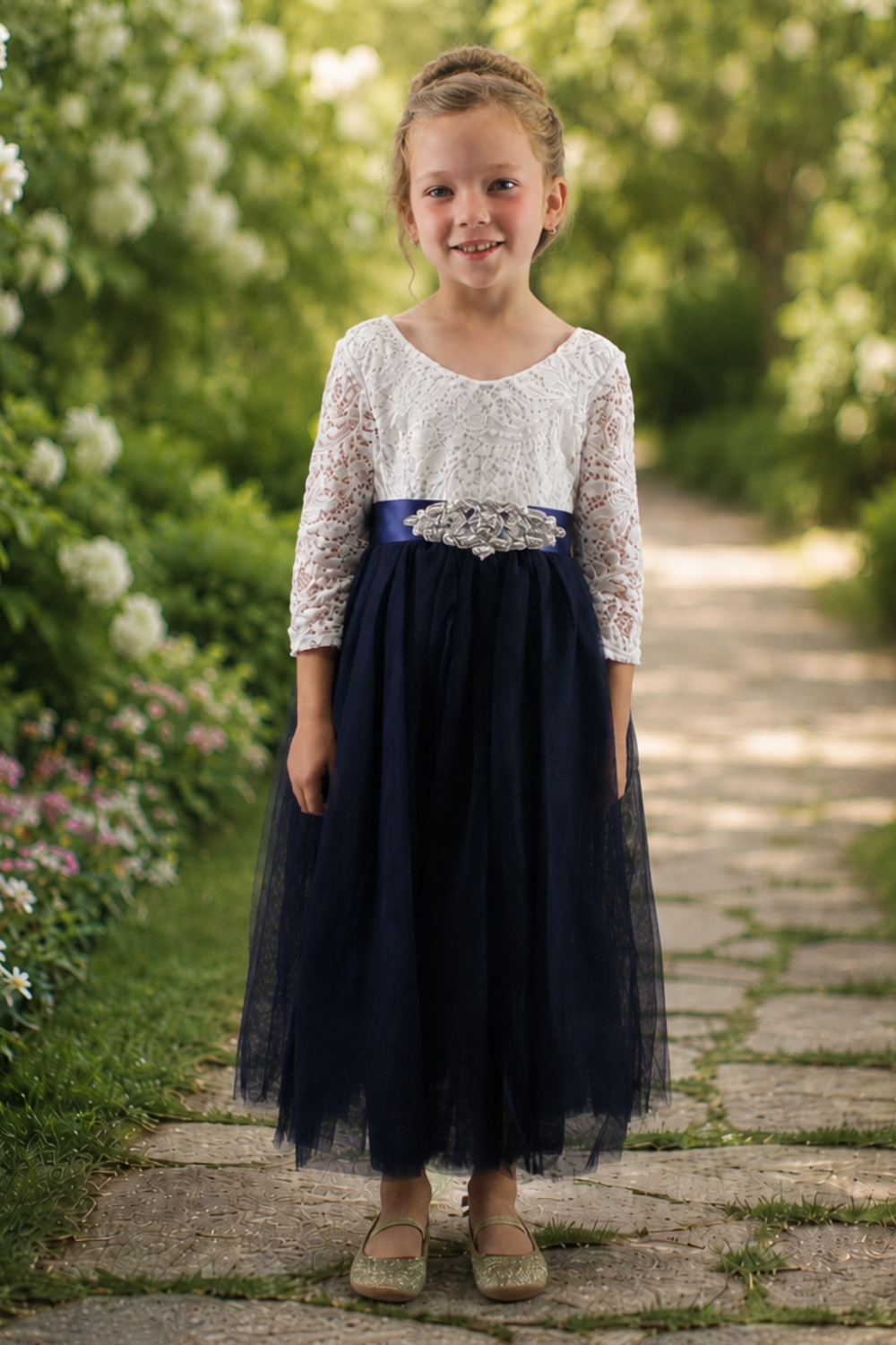 flower girl dress in navy blue tulle with white lace long sleeves in an ankle length style. 