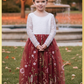 flower girl in rust floral embroidery tulle with long lace sleeves and full length dress. 