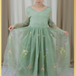 Sage green floral flower girl dress in embroidered tulle. featuring long lace sleeves and full length floral tulle dress. 