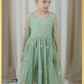 Sage green floral flower girl dress in embroidered tulle. featuring long lace sleeves and full length floral tulle dress. 