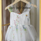 Baby girl first birthday fair dress in white florals.