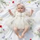 white wildflower floral baby girl dress with built in romper bodysuit. 