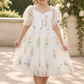 ivory floral embroidered tulle flower girl dress with puffy sleeves and nee length style.  