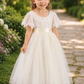 flower girl dress in ivory tulle and white lace short sleeves. 