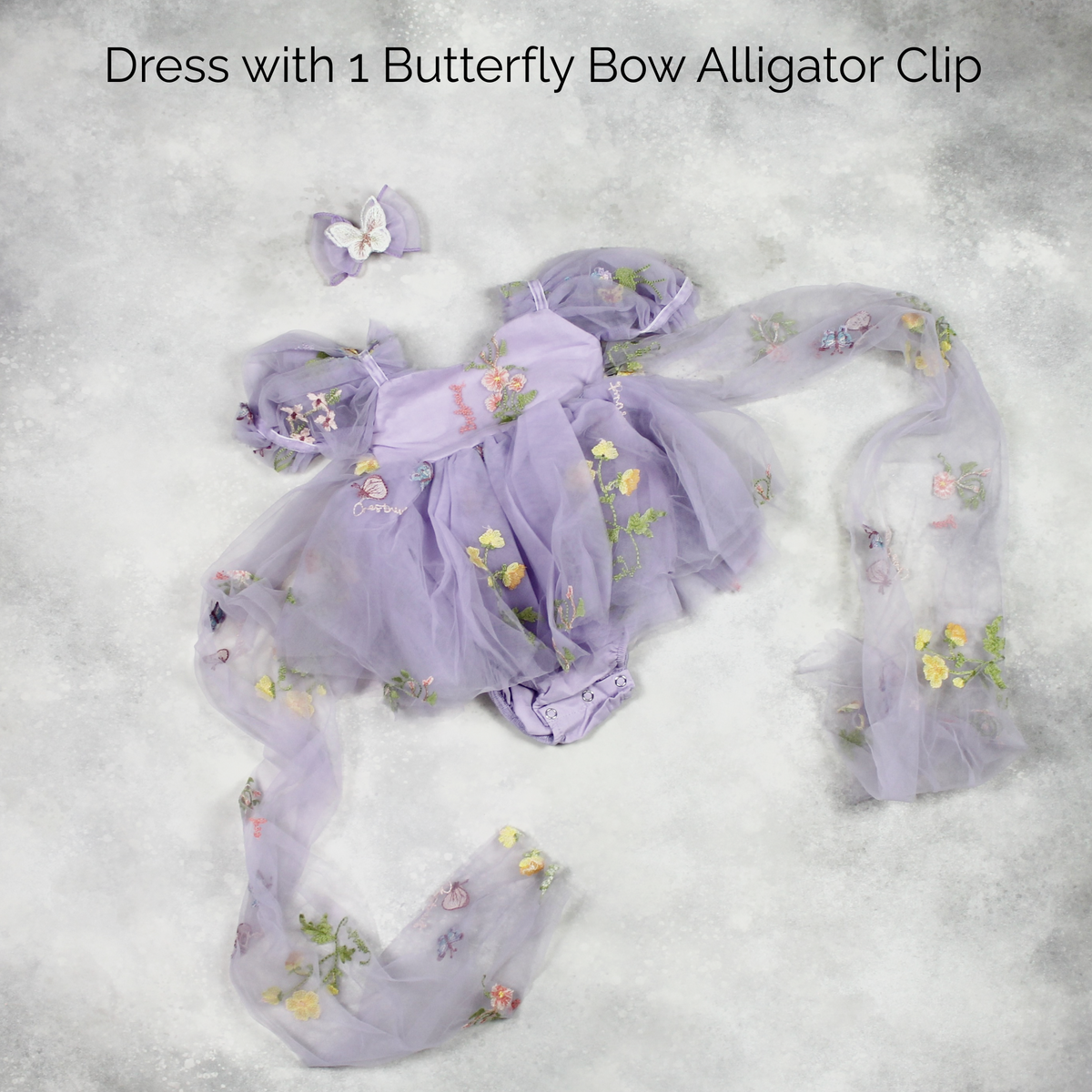 First birthday baby girl dress in lavender floral tulle with built in romper/bodysuit and puffy  short sleeves.