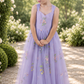 flower girl dress in lavender floral embroidered tulle in a sleeveless full length style. 