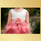 blush flower girl dress in a tiered sleeveless tutu style. In lace and tulle. 